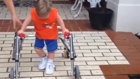 Boy with Down Syndrome takes his first steps