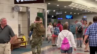Soldier comes home and greets his family
