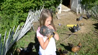 Girl holding Young Chick Adorable