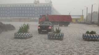Huge Hailstorm Pummels Parked Car