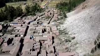 Landslide engulfs Peruvian town, threats linger