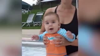 Funny Baby Plays With Water