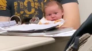 Baby Left Perplexed by Dad's Study Guide