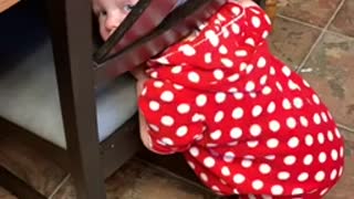 Toddler gets her head stuck in a chair