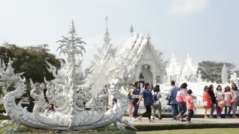 Tourists in front of the white temple
