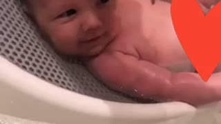 Adorable 1 month old loves his head scrubbed