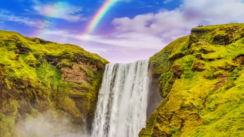 Waterfall rainbow cliff scenery