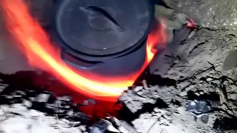 Forced air sand stove.