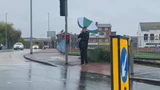 Storm Makes Man's Umbrella into Water Catcher