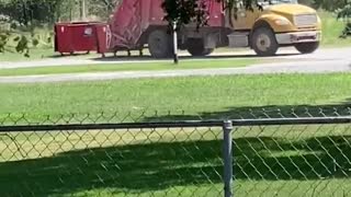 Dump Truck Drives Off with Dumpster
