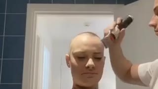Boyfriend surprises his girlfriend by shaving his head after shaving hers