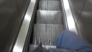running down the escalator - New York City, subway