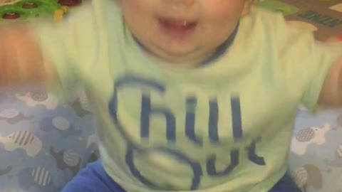 Baby so excited to be on camera he falls over!