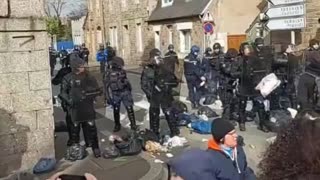 French Protestors Throw Trash at Macron's Forces