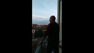 Man sings opera from his balcony for his neighbors