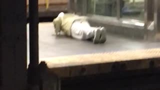 Man white pants doing push ups elevator