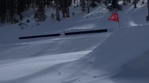 Pt. 2 skier jumps off big ramp and lands on front of skis, falls down slope