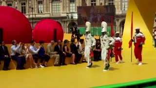 Louis Vuitton brings marching band to the Louvre