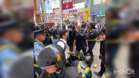 Japanese riot police clash with anti-G7 Summit protesters in Hiroshima. Some of the participants in the protest were wearing white helmets marked with the names of radical left-wing organizations.