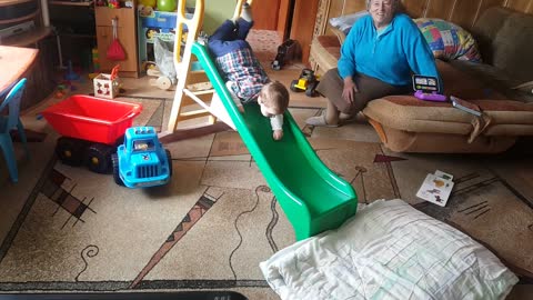 2 Years old Toddler finds his own way to use slide