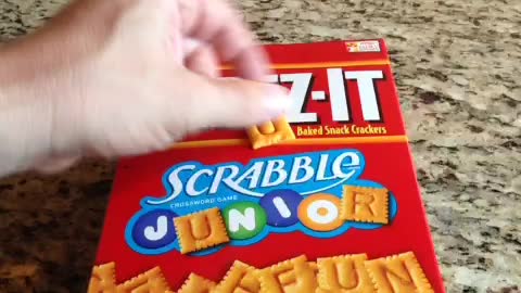 Taking crackers from a box without opening it
