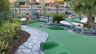 Girl Cheats While Playing Mini Golf But Scores Lucky Shot