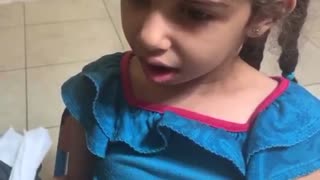 Brave girl gets her first tooth removed