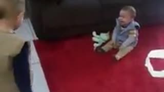 Baby boy can't stop laughing at big brother's antics
