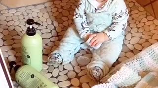 Naughty baby makes huge mess in the shower, feels no remorse
