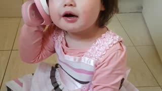 Adorable toddler uses shoe as personal telephone