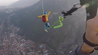 Watch this skydiver fall while trying to walk a tightrope