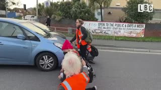 Furious drivers drag Insulate Britain eco-mob activists off the road