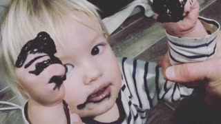 Baby eating paint