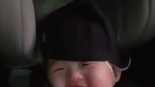 Sweet baby laughs in adorable manner