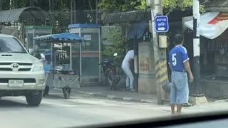 Lending a Helping Hand to Elderly Lady Crossing Street