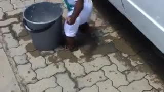 Watch This Adorable Toddler "Help" Wash the Car!