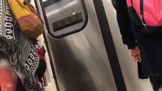 Two kids kicking each other on train