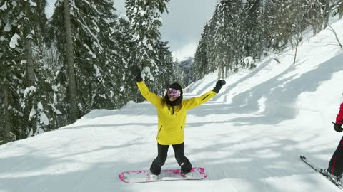 Happy Woman Jumping on Snow