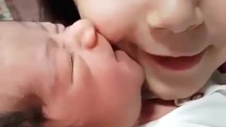 Cute Baby Girl Kissing lovely Sister. Nice Baby. Beautifull baby girl.