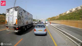 Moped riders collide while trying to cut traffic on the shoulder